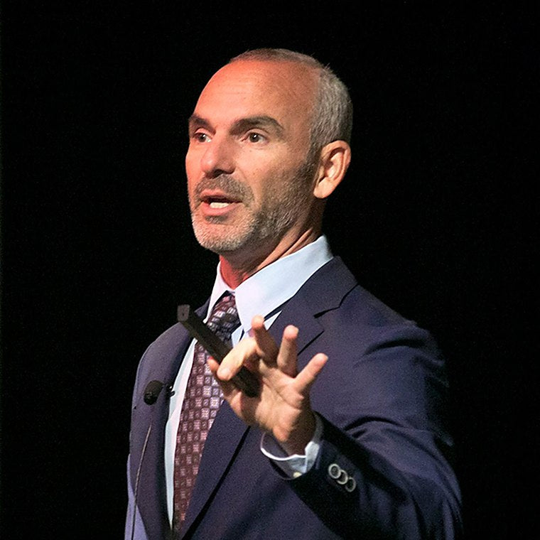 Dr. Jack Wolfson teaching on stage
