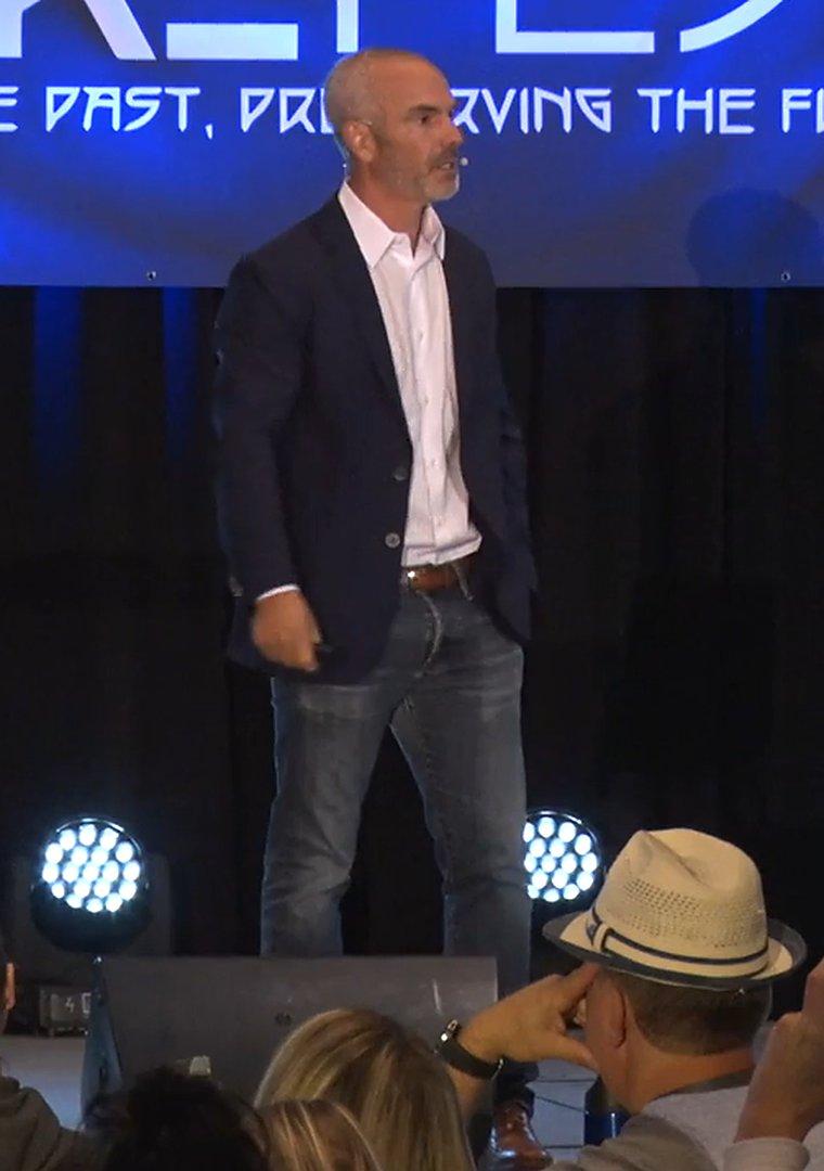 Dr. Jack Wolfson speaking on stage